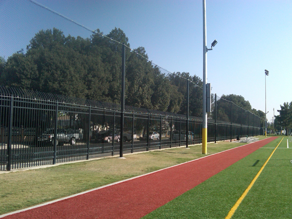 Judge Netting Barrier Specialists: A barrier with red and yellow stripes.
