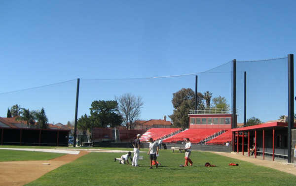 Judge Netting Barrier Specialists: A baseball field with a protective barrier netting fence.