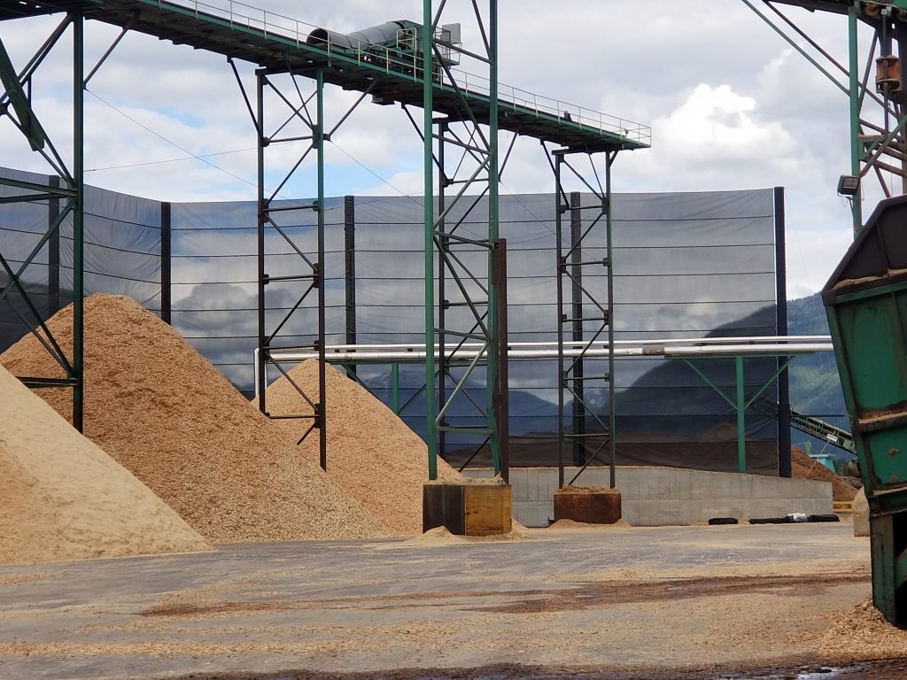 Judge Netting Barrier Specialists: A large pile of sand at a construction site using netting barrier solution.