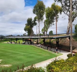 Custom-engineered netting barrier protecting rooftop solar panels from golf balls at Palos Verdes Golf Club