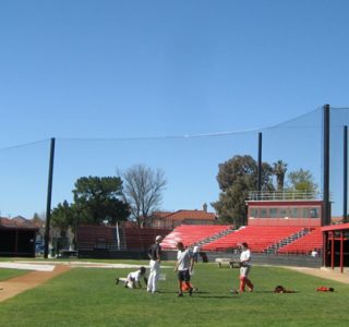 Judge Netting Barrier Specialists: A baseball field with a protective barrier netting fence.