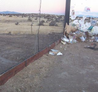 Judge Netting Barrier Specialists: Litter containment netting barrier protecting a field.