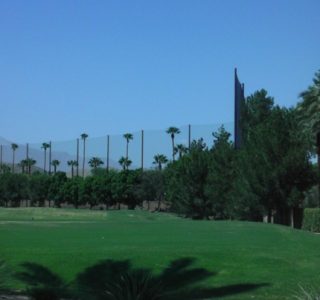 Judge Netting Barrier Specialists: A golf course in Palm Springs with palm trees and driving range netting.